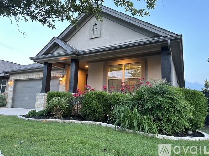 A house with a front yard and a garage.