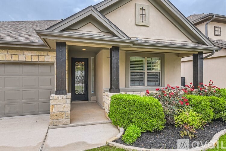A house with a black door and a small window above it.
