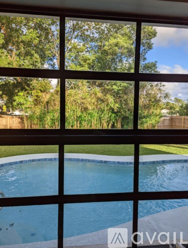 A pool seen through a window.