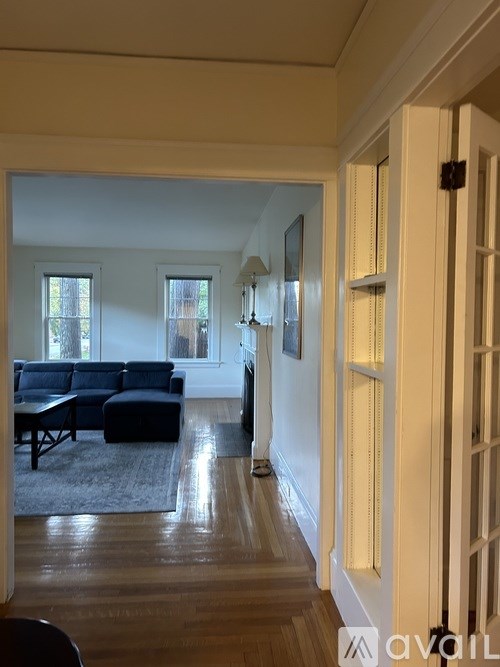 A living room with a couch and a table.