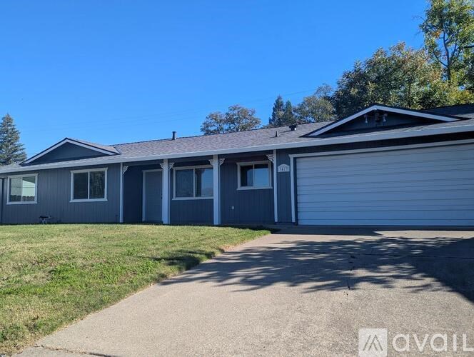 A house with a garage is available for rent.