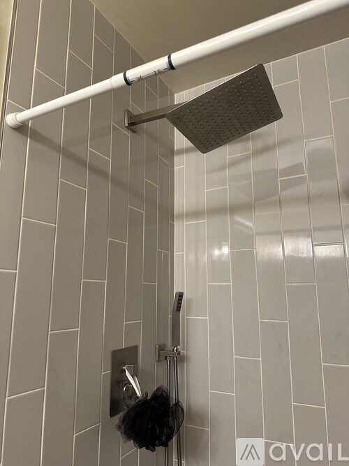 A shower head is mounted on a wall.