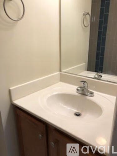 A bathroom sink with a mirror above it.