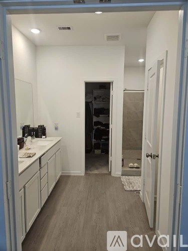 A bathroom with a sink and mirror.