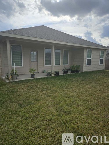 A house with a lawn in front of it.
