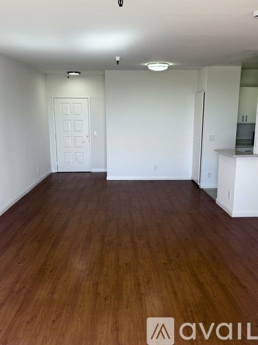 A room with wooden floors and white walls.
