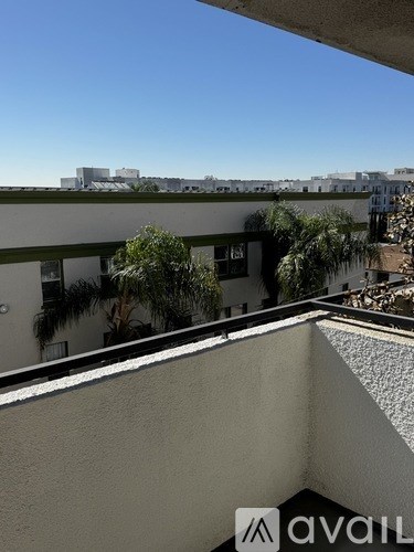 A balcony with a view of the cityscape.