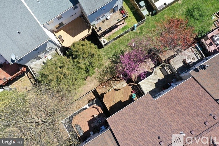 A bird's eye view of a residential area with houses and trees.