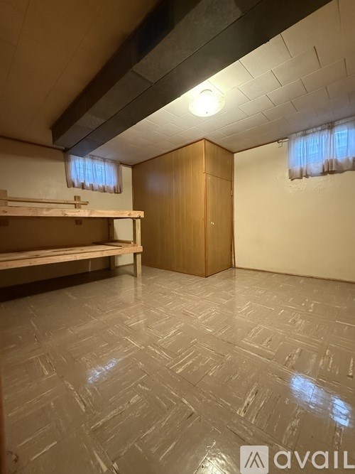 A room with a bench and a cabinet.