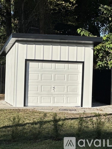 A bathroom with a marble floor and white walls.