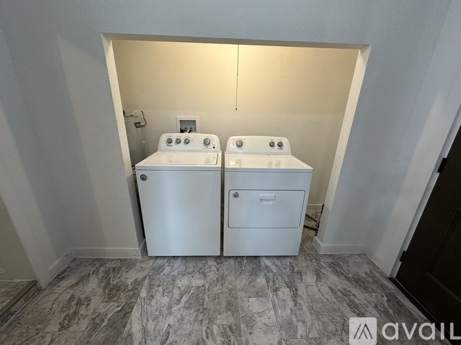 A bathroom with two sinks and a toilet.