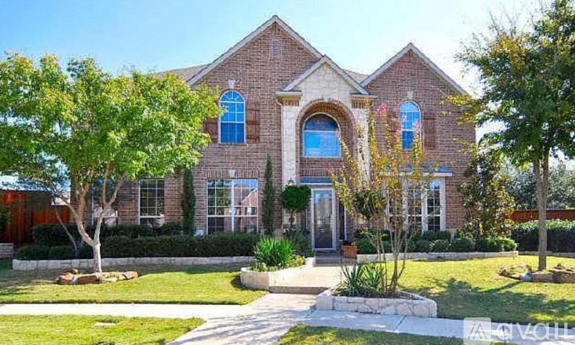 A large house with a red brick exterior and a blue window.