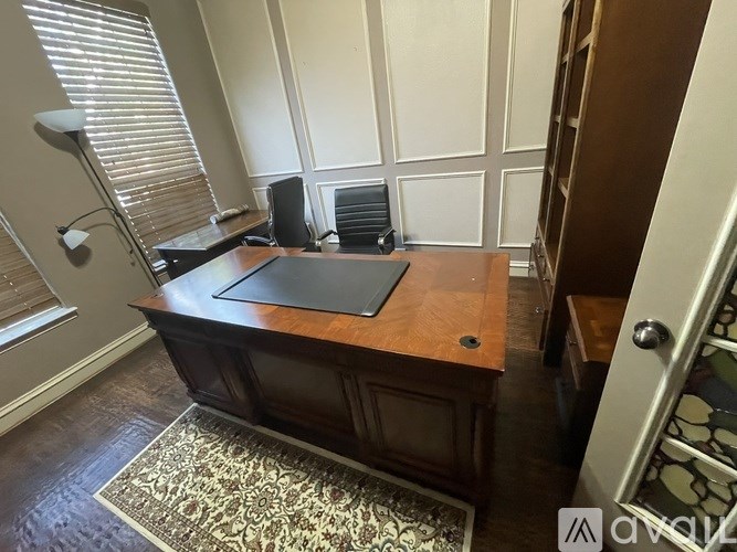A room with a desk and a chair.