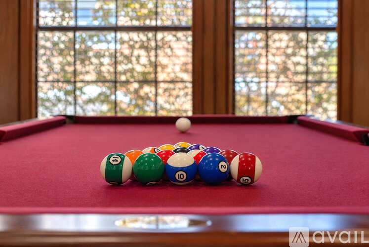 A pool table with balls numbered 10, 11, 12, 13, 14, 15, 16, 17, 18, 19, 20