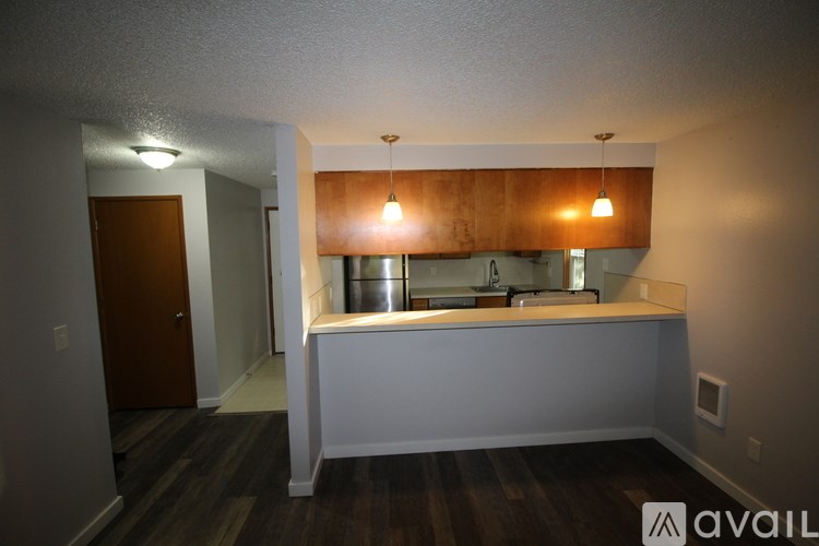 A kitchen area with a sink and a countertop.