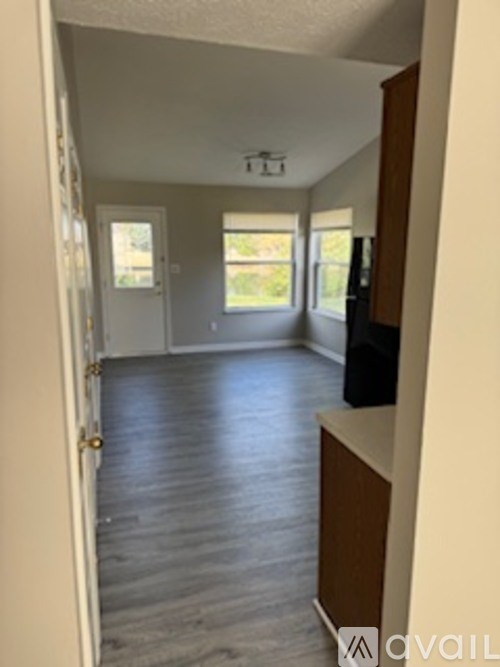 A room with a door and a window.