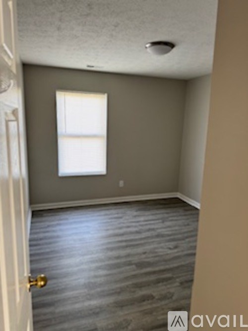 A room with a door and a window.