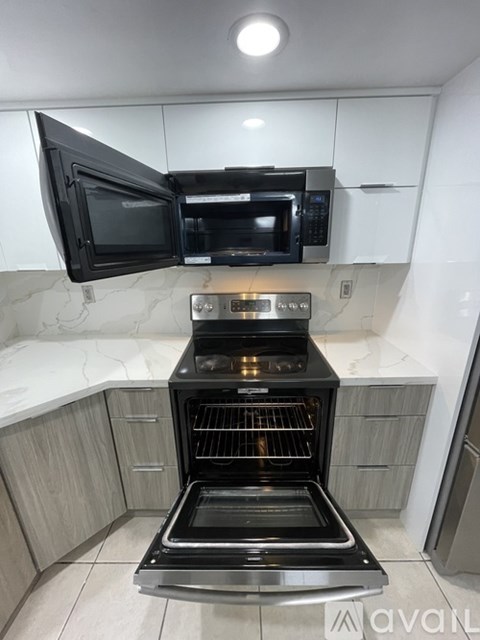 A black oven with a glass door is in a kitchen.