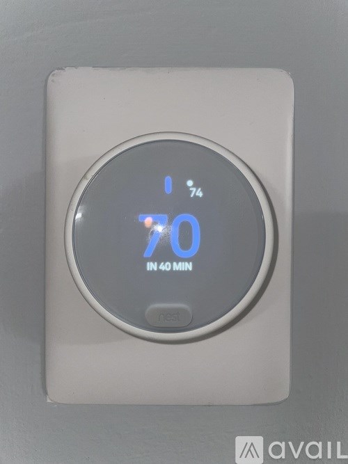A digital thermostat shows a temperature of 70 degrees.