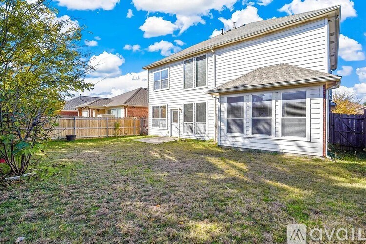 A house with a large backyard is for sale.