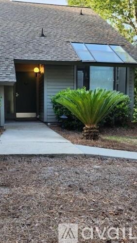 A house with a black door and a glass window.