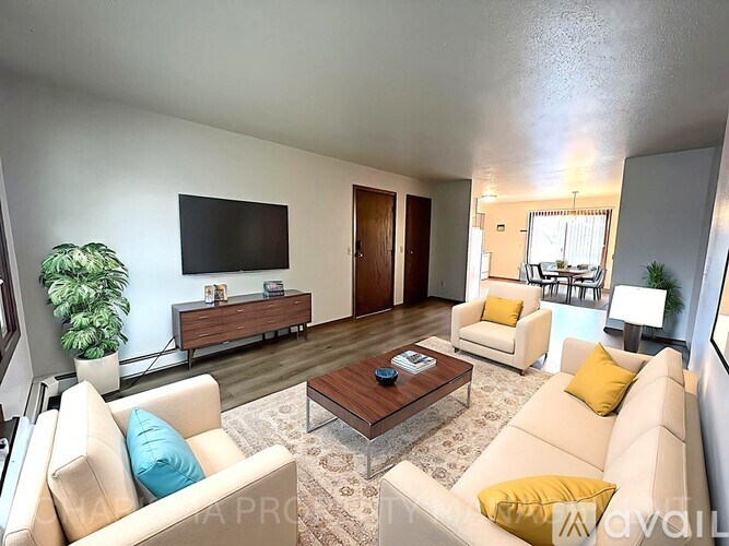 A living room with a couch, chair, and coffee table.