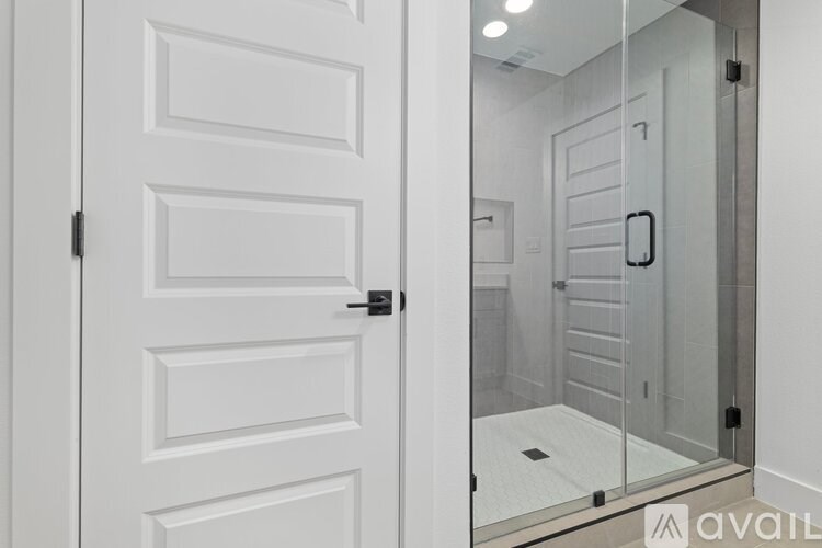 A white door with a glass panel on the other side.