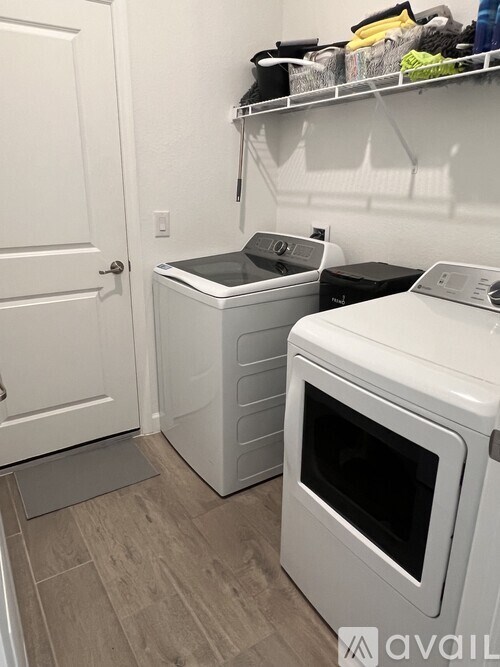 A white oven and dishwasher in a small kitchen.