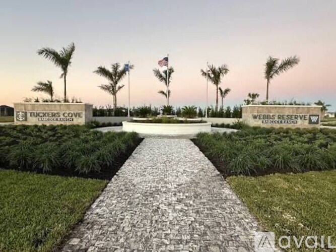 A stone pathway leads to a sign that says Webb's Reserve.