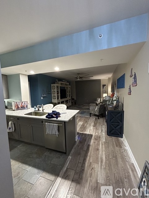 A kitchen with a sink and a counter.
