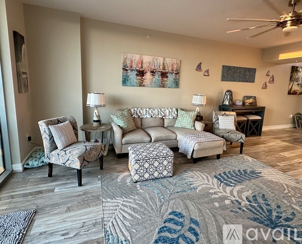 A bedroom with a bed, nightstand, and lamp.