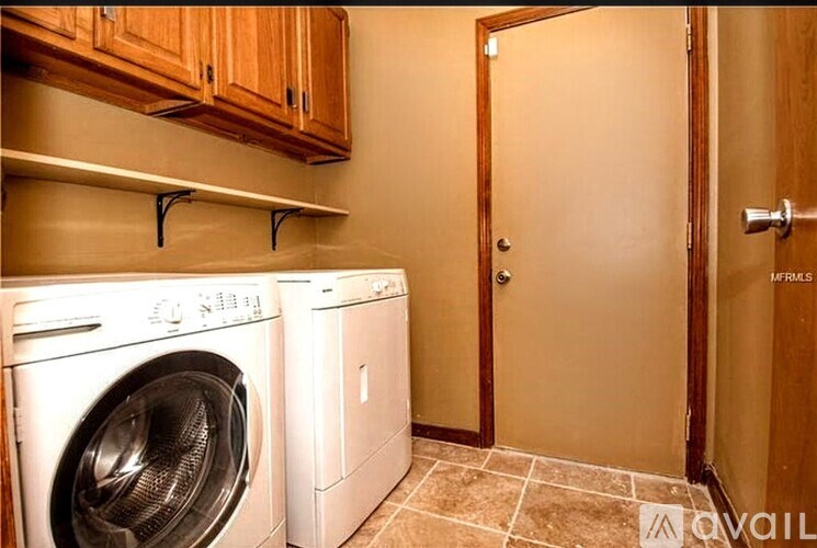 A laundry room with a washer and dryer.
