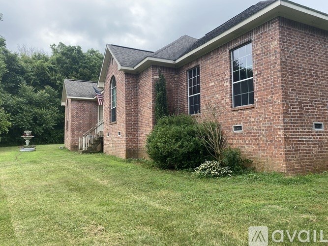A brick house with a flag on the front.