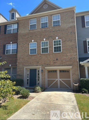 A brick building with a blue door and windows.