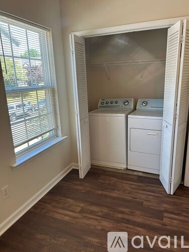 A laundry room with a washer and dryer in it.