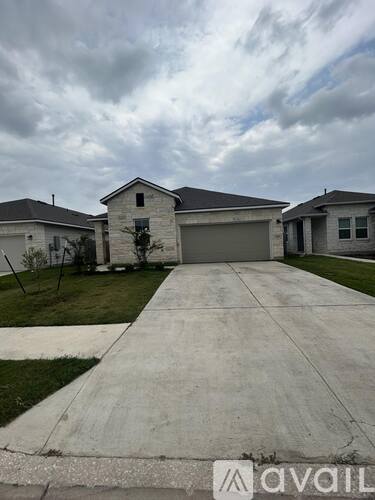 A house with a driveway in front of it.