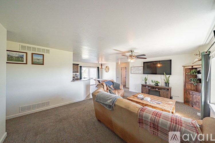 A living room with a couch and a television.