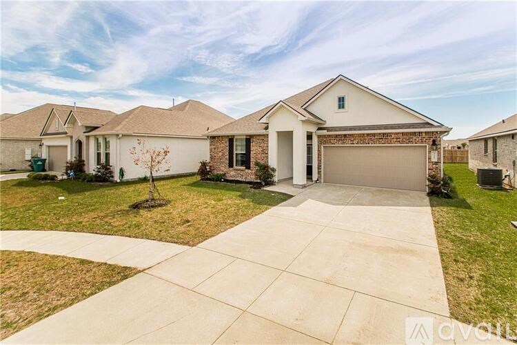 A house with a driveway in front of it.