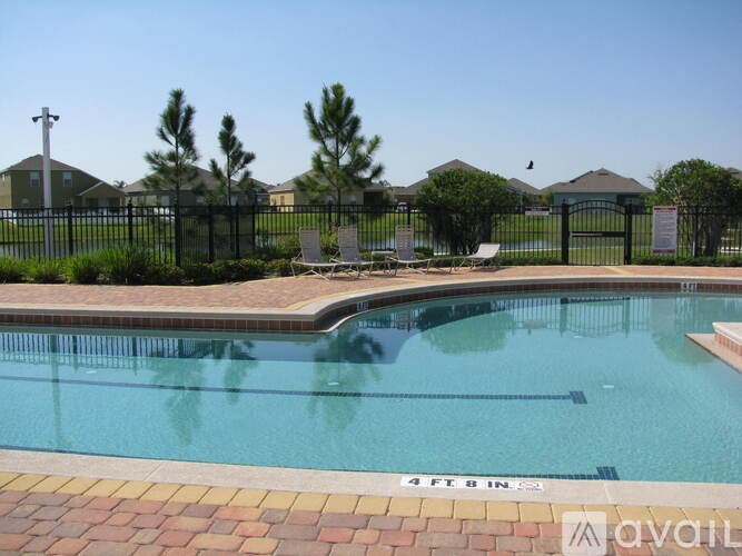 A pool with a 4 feet depth sign on the side.