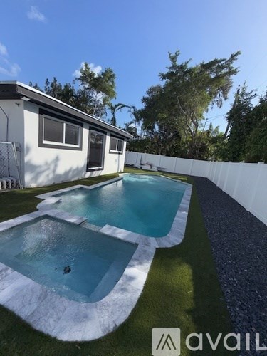 A house with a pool in the backyard.