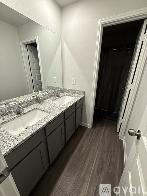 A bathroom with a sink and mirror.