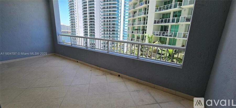 A balcony with a view of a city skyline.