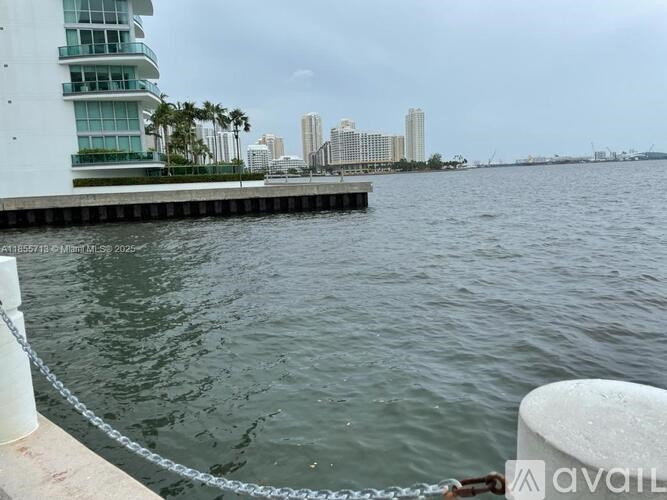 A view of a city skyline from a waterfront.