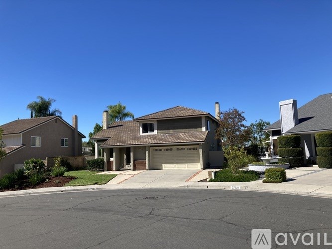 A house with a garage is available for sale.