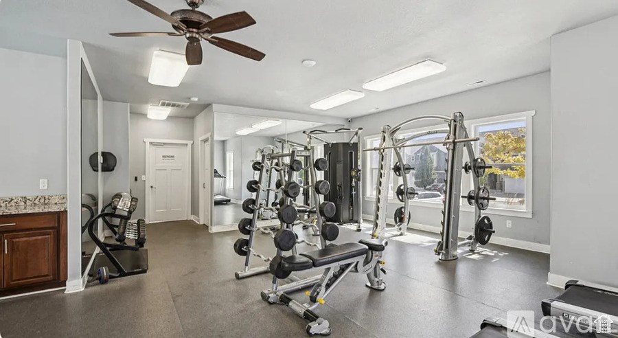 A well-equipped home gym with a variety of exercise equipment.