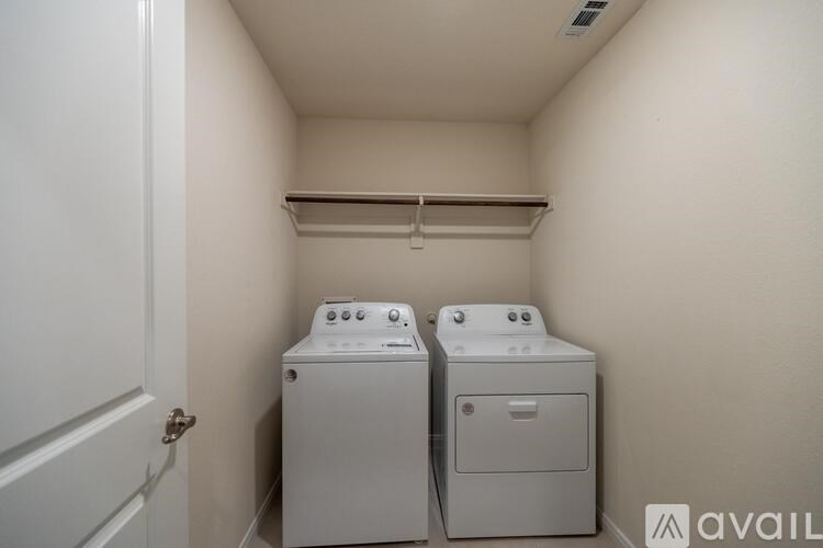 A laundry room with a washer and dryer.
