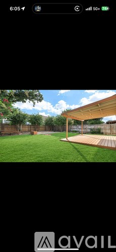 A wooden deck with a pergola over it.