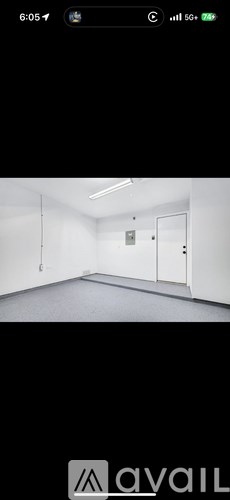 A room with white walls and a door.