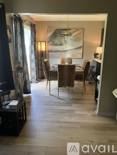 A kitchen with black cabinets and a white countertop.