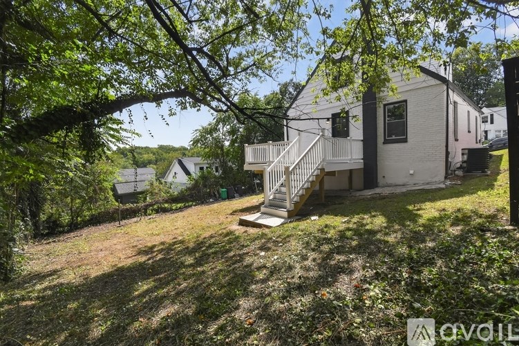 A house with a tree in front of it.
